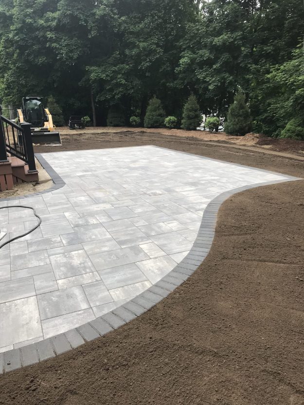 Hardscaping and Landscaping for a Residential Client: Patio, Lawn Renovation, Plantings and Mulching