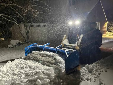 Reliable landscaper near Manchester NH for commercial snow removal with a skidsteer