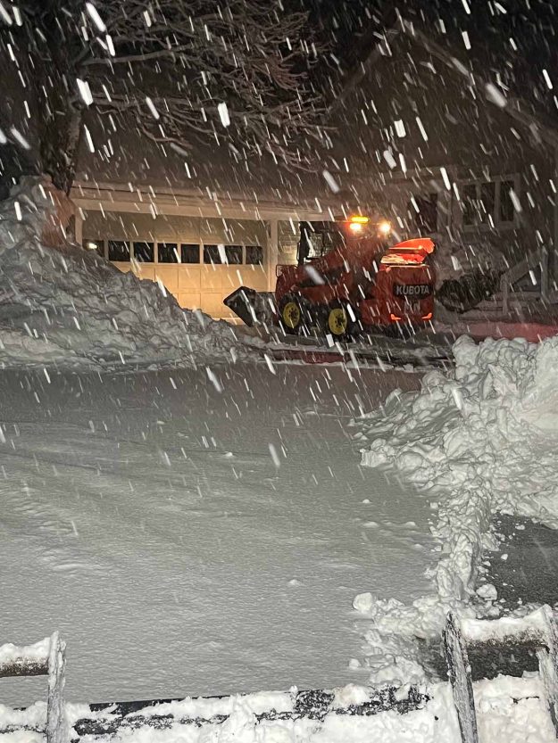 Reliable landscaper near Manchester NH for commercial snow removal with a skidsteer