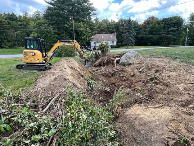 Reliable landscaper near Derry, NH for residential stump removal with a mini excavator