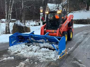 Reliable landscaper near Manchester NH for commercial snow removal with a skidsteer