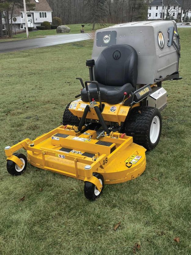 Reliable landscaper for residential lawn care with Walker mower.
