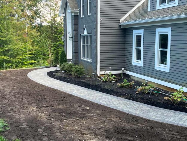 Reliable landscaper near Bedford NH for residential walkway and plant install.