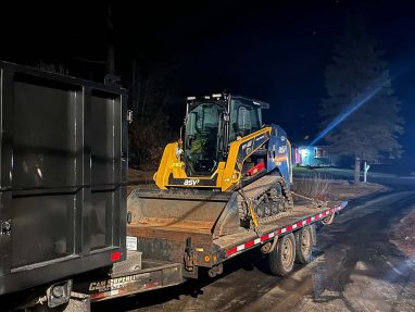 Reliable landscaper near Manchester NH for commercial snow removal with a skidsteer