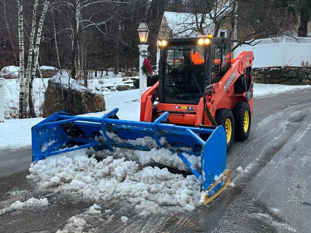 Reliable landscaper near Manchester NH for commercial snow removal with a skidsteer